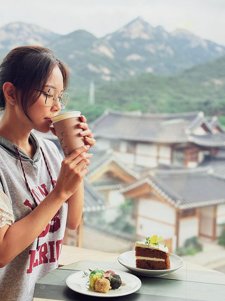 Ms Karyl enjoying a drink by the window at Irin Iljan